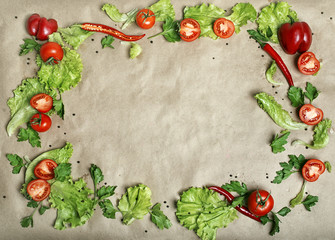 frame of fresh vegetables on wet paper
