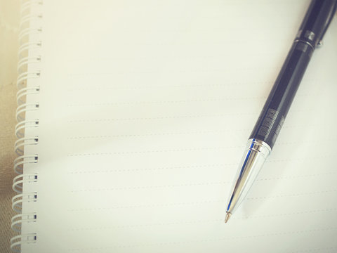 Ballpoint pen on blank sheet notebook (Vintage tone)
