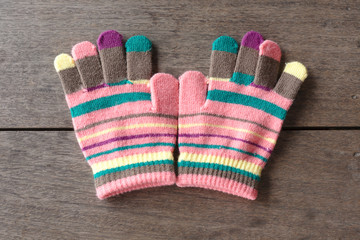 gloves for baby on old wooden