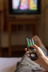 Watching TV and using remote controller.