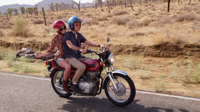 Couple riding motorcycle