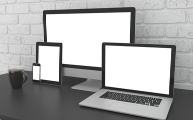 Responsive mockup screen. Monitor, laptop, tablet, phone on table in office.