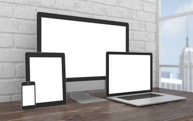 Fototapeta premium Responsive mockup screen. Monitor, laptop, tablet, phone on table in office.