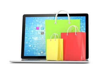 laptop and  shopping pags on white background