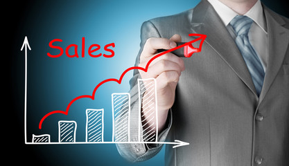 business man drawing graph of sales - 105401878