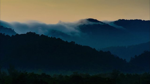 Timelapse Flow of cloud pass mountain edge in Morning at Ranong, Thailand
