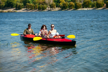 People of all ages in a kayak. Family holiday.