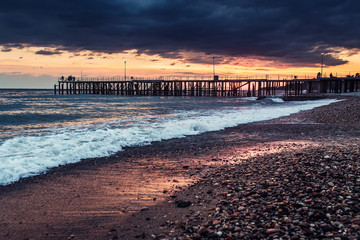 Obraz premium Sunset on the beach with pebbles, Abkhazia, New Athos