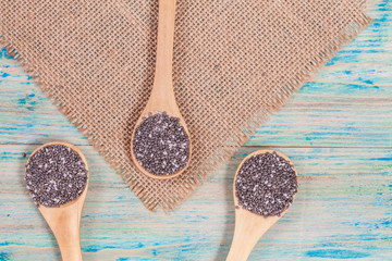 Nutritious chia seeds on a wooden spoon