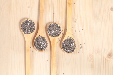 Nutritious chia seeds on a wooden spoon
