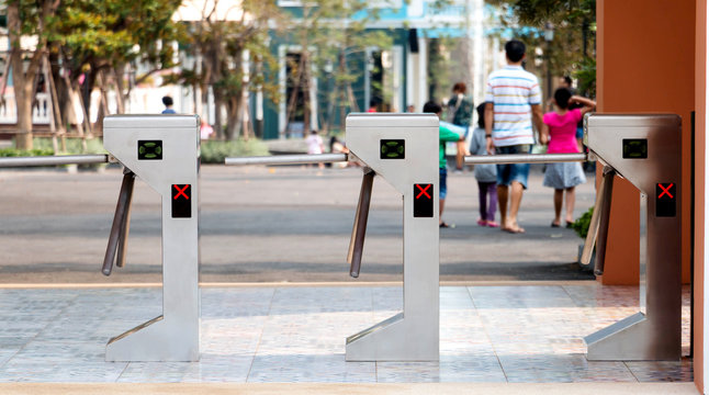 electronic turnstiles in front of amusment park