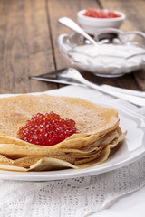 Homemade crepes with red caviar