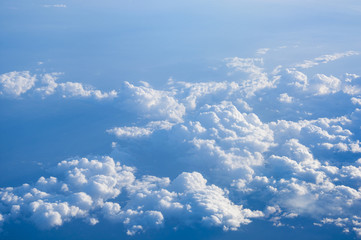 Clouds in blue sky aerial view from plane