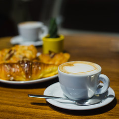 Morning cup of coffee with croissants