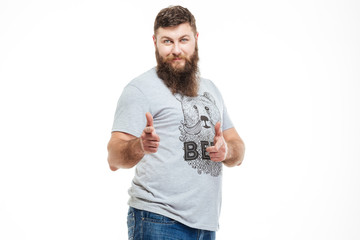 Happy bearded man pointing on young with both hands