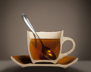 half cup with tea and spoon