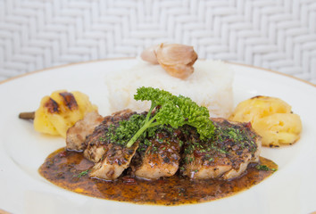 Roasted pepper pork served with rice and pineapple

