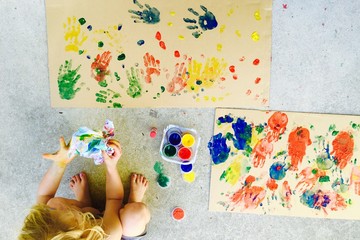 Girl with Finger Paint Mess on Hands