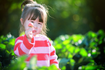 Girl in strawberry field