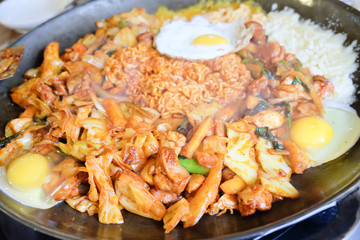 Fried Kim Chi with cheese, pork, egg, vegetables and noodles, Traditional Korean food.