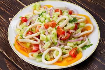 Squid, tomato, onion and greens salad