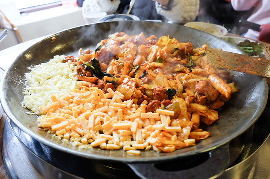 Fried Kim Chi with cheese, pork, egg, vegetables and noodles, Traditional Korean food.