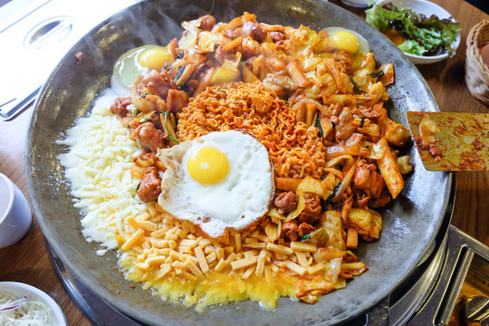 Fried Kim Chi with cheese, pork, egg, vegetables and noodles, Traditional Korean food.