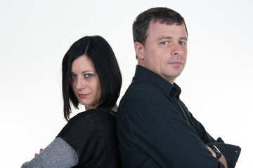 Couple mid aged standing back to back having relationship difficulties. Isolated on white background