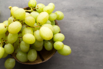 Grape cluster on the grey background.