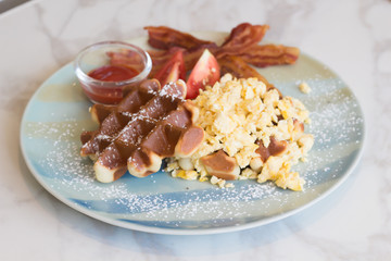 Waffle, egg and bacon for breakfast