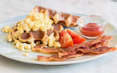 Waffle, egg and bacon for breakfast