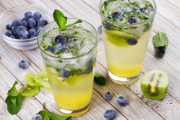 Kiwi and blueberry mojito