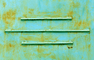 Rusty green metal texture with lines.