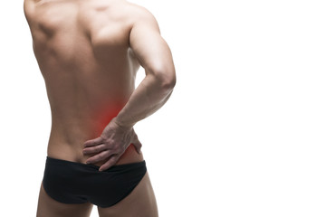Kidney pain. Man with backache. Pain in the human body. Muscular male body. Isolated on white background