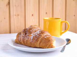 Continental breakfast on the white wooden table