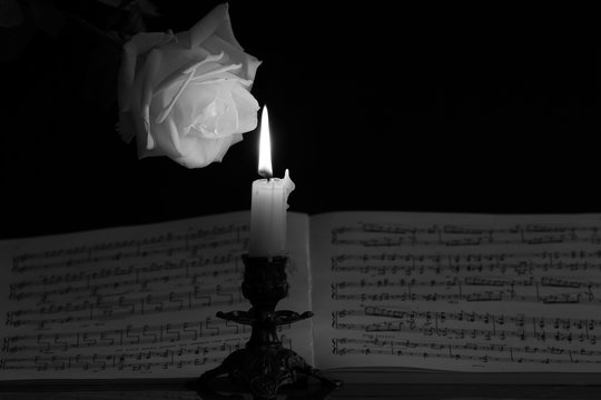 White Rose, Music Notes And Burning Candle