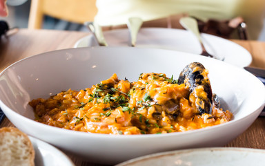 Seafood risotto on white plate