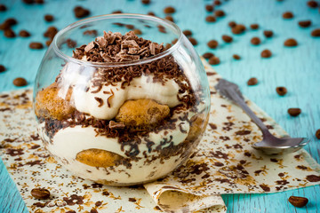 Traditional Italian dessert tiramisu cake in a glass