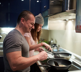 Couple cooking at home
