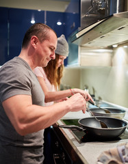 Couple cooking at home