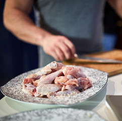 Man chopping chicken wings