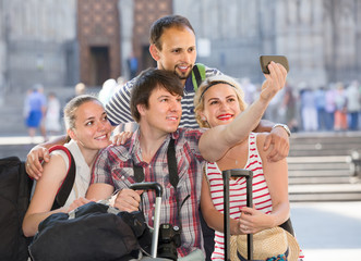 Group of tourists making selfie