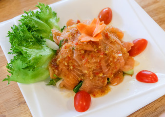 Spicy salmon salad with mixed vegetable and herb