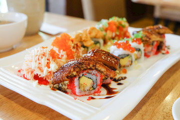 Sushi set ; sushi roll with salmon and smoked eel