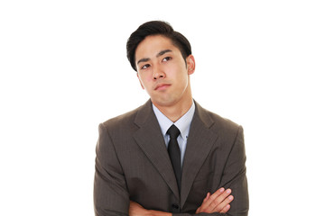 疲れた表情のビジネスマン