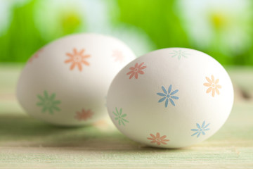 White Easter eggs on nature background