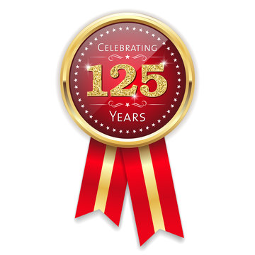 Red celebrating 125 years badge, rosette with gold border and ribbon