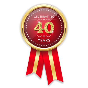 Red celebrating 40 years badge, rosette with gold border and ribbon