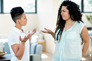 Unhappy lesbian couple arguing with each other