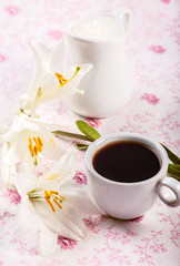 Coffee cup and flowers